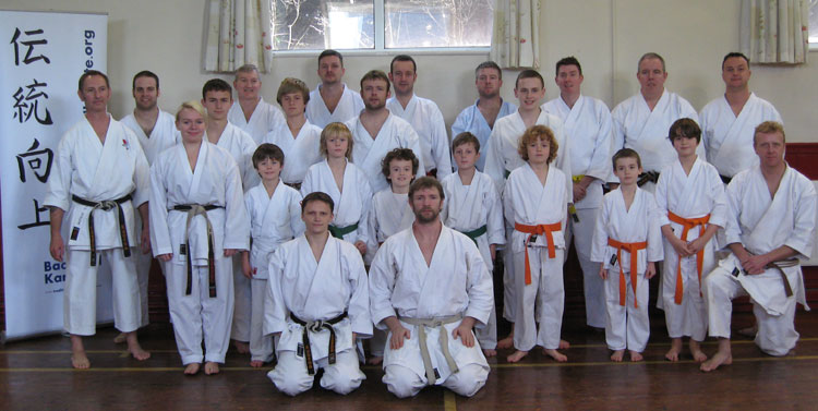 Sensei Matt Price lines up with the class for a photo